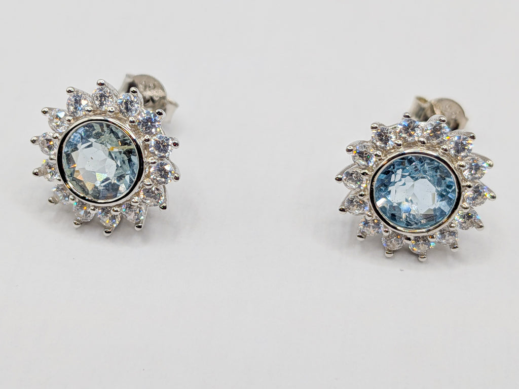 Puces fleur topaze bleue naturelle en argent 925 | Ecrelya Prestige